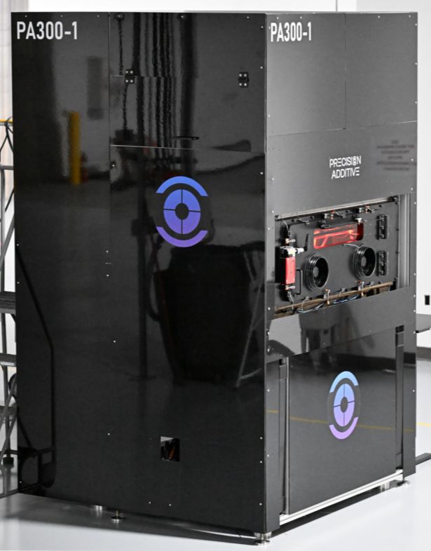 A black industrial machine labeled "PA300-1" with purple and blue circular logos and "Precision Additive" text, conveying high-tech functionality.